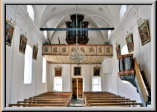 links von der Orgel sind die biden Hebel zur manuellen Windschöpfung über zwei Mehrfaltenbälge zu erkennen.